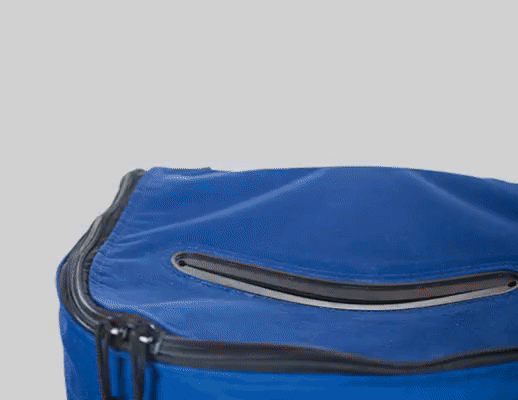 A blue bag with black trim and zipper.